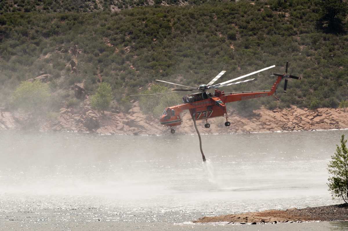 An Erikson Air Crane heavy tanker fills up with 2600 gallons of water from Horsetooth Reservoir. Photo: John Sheesley for the Rocky Mountain Collegian