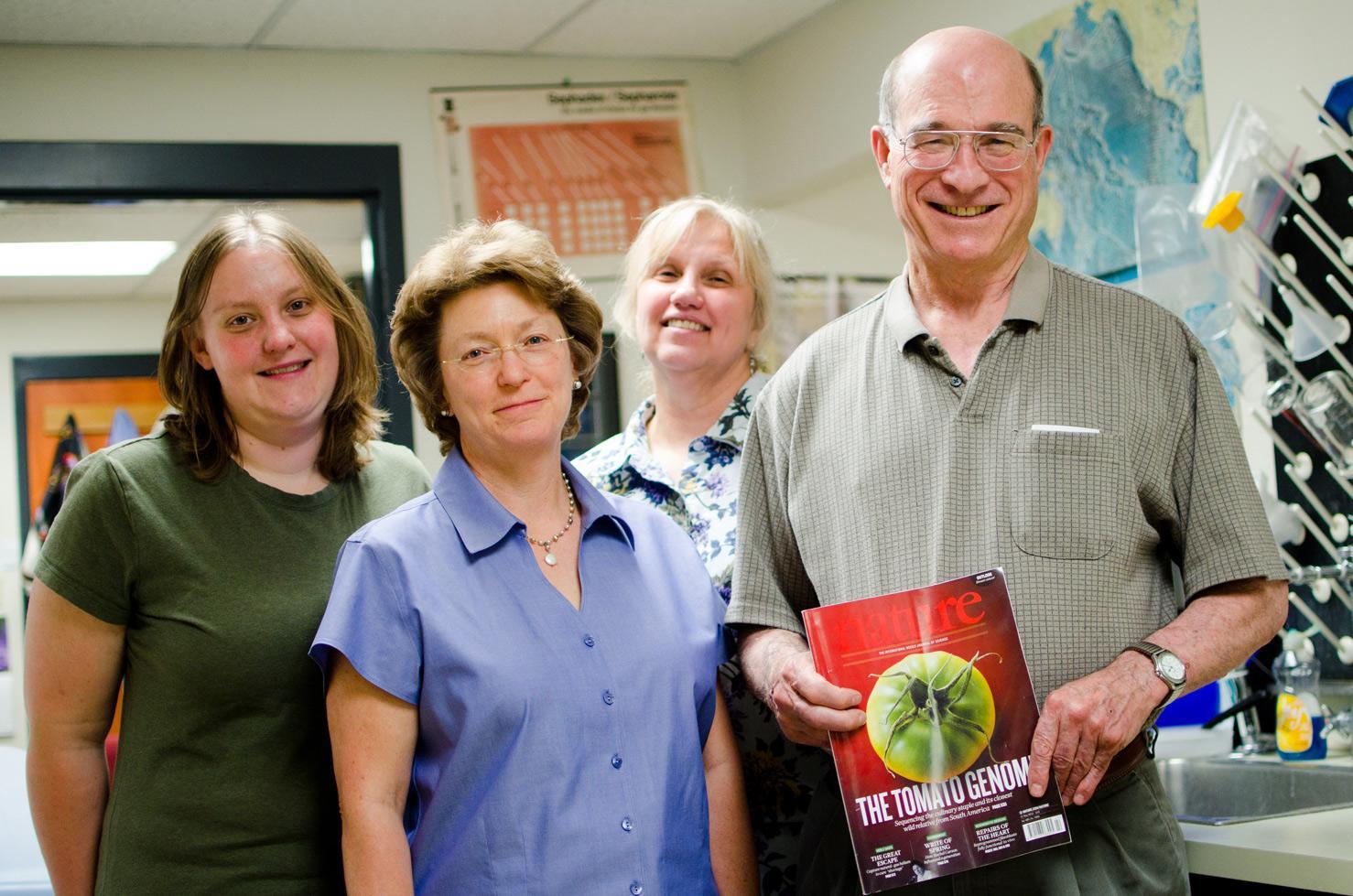 From left to right, Lindsay Shearer, Lorinda Anderson, Suzanne Royer and Stephen Stack stand with a copy of Nature. The four are part of a multinational, nine year project that sequenced the tomato genome. Photo by Nic Turiciano for the Collegian.