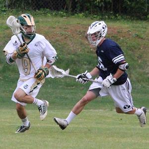 CSU lacrosse attackman Austin Fisher avoids defenders against BYU in the MCLA semi finals May 17 in Greenville, SC. The Rams defeated the Cougars 11-5 and Cal Poly 7-5 en route to the MCLA title.