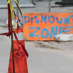 Construction sites will post specific dismount zones.