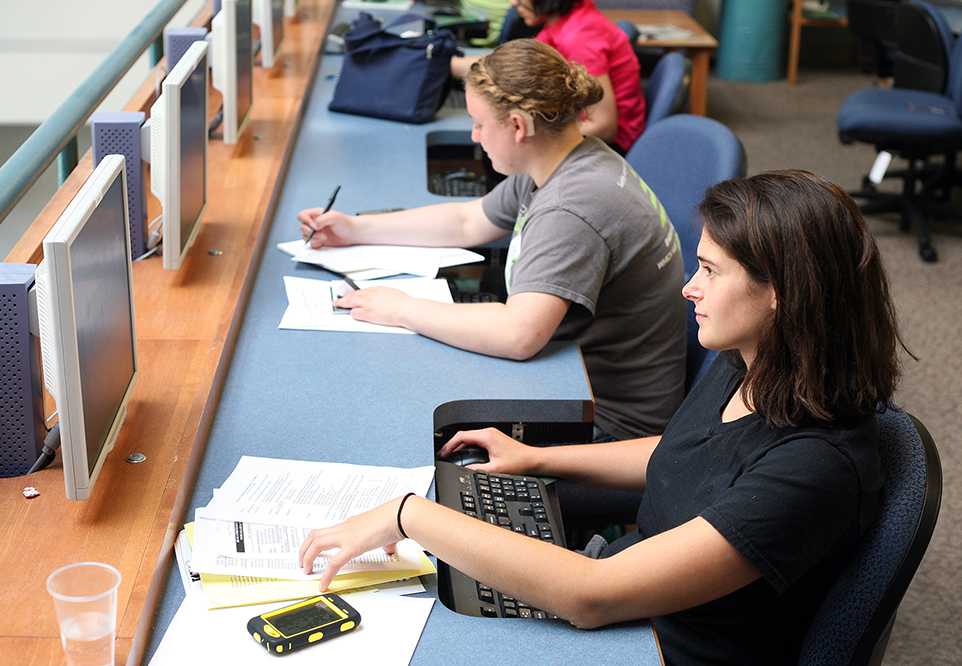 Rachel Acker, a junior environmental engineering major, studies with Alexa Garfinkel, center, the activities director of the Society for Women Engineers, in the Internet Café Tuesday. Acker and Garfinkel represent the record breaking cohort of women interested in Engineering at CSU.