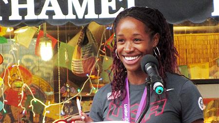 Janay DeLoach speaks in Old Town Square last week in a Rally Honoring Olympic Medal Winners. DeLoach won the Bronze Medal at the Summer Olympics for her 22 3/4 long jump and is currently ranked second in the world for long jump.