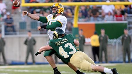 Senior James Skelton hits North Dakota State QB Brock Jensen in the third quarter of CSU's opening day game at Hughes Stadium. Coloardo State will take on Utah State Saturday at Hughes Stadium, looking to pull there record to an even .500.