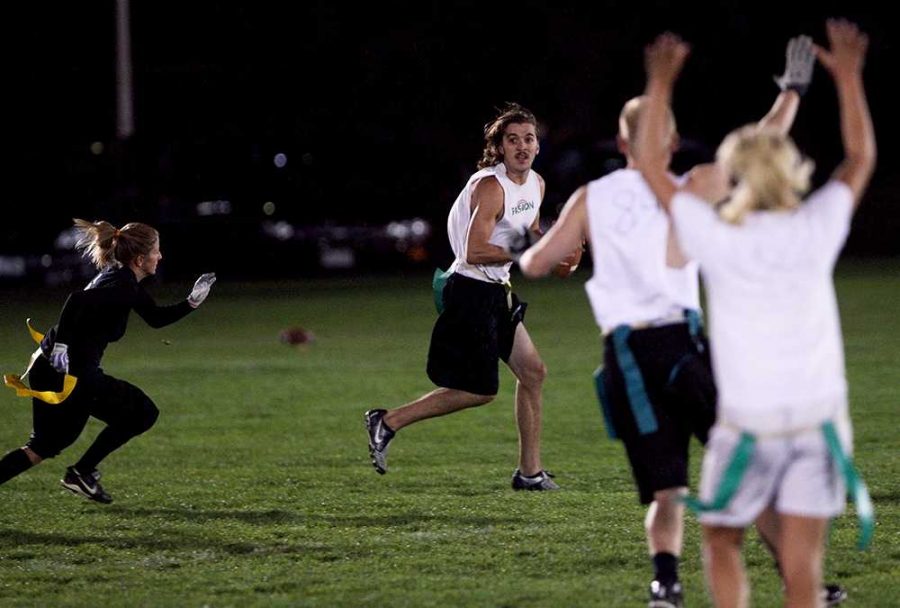 Junior Donny Maclachlan natural resource & tourism major looks for an open reciever Tuesday night during co-ed intramural football.