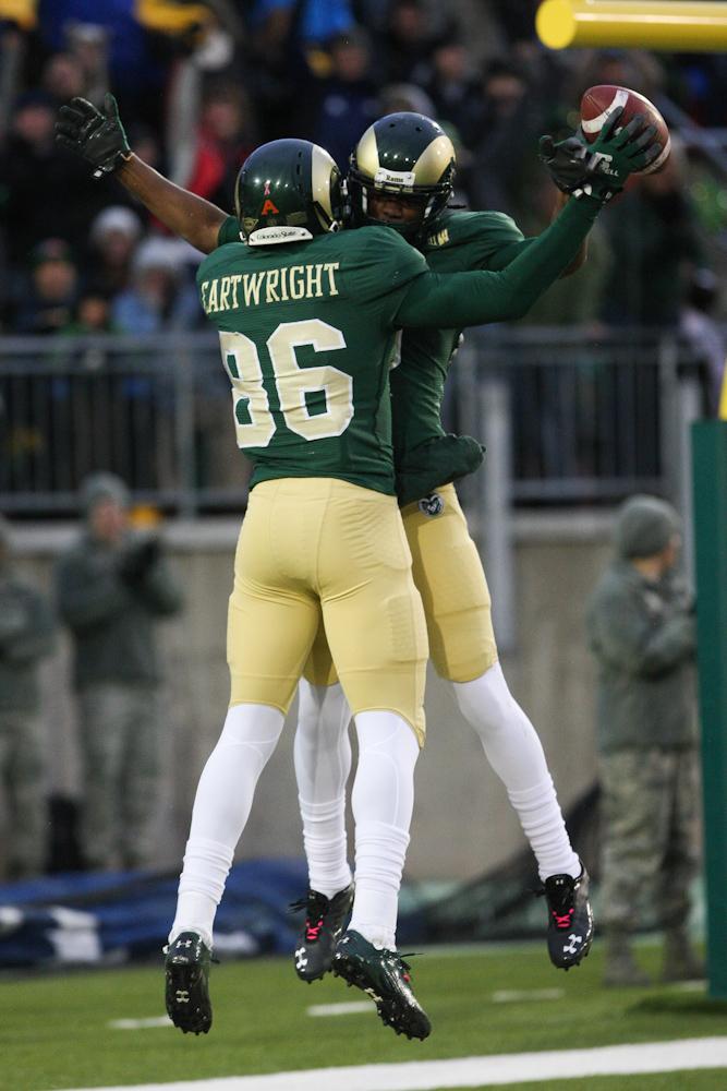 Kivon Cartwright (86) celebrates a touchdown with Marquis Law (9) during the first half of Saturday game against Fresno State. The touchdown was called back after a flag was thrown on the play and the Rams eventually fell short to the Bulldogs 28-7.