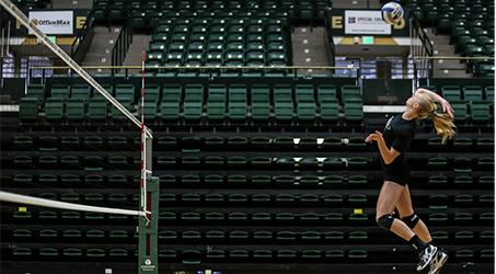 Kelsey Snider performs a spike during practice Monday afternoon.