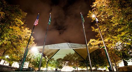 Four flags wave silently outside of the LSC Theater Tuesday night. Because of the LSC renovations, ASCSU is reexamaining the process and future of flying the flags at half-mast after a student passes away.