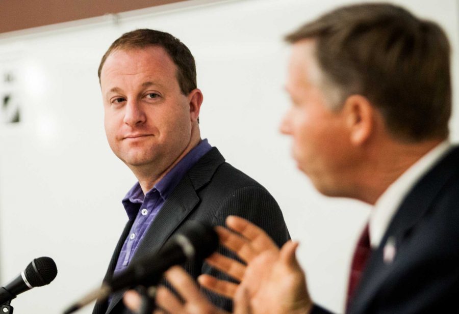 Jared Polis, left, watches Kevin Lundberg as he responds to a question in the debate in Clark between the second congressional district candidates. ASCSU sponsored the debate.