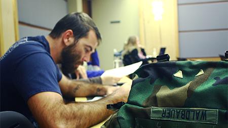 Army veteran Drew Waldbauer attends class on Friday. Waldbauer works at the Adult Learner and Veteran Services center where the goal is to help support the transition, education, and involvement of adult learners and veteran students.