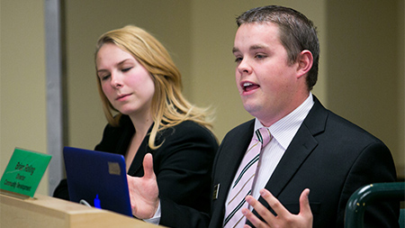 Director of Community Development, Brian Roling, right, speaks during the Senate meeting Wednesday night in the Lory Student Center.
