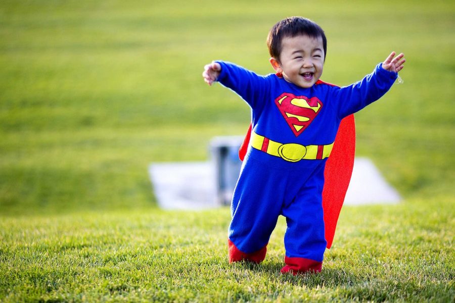 Haruto Yoshikawa chases his big brother while donning his Superman halloween costume on the West Lawn Wednesday evening. Yoshikawa is a refreshing reminder of why houseowners give out candy to young kids and not college students.