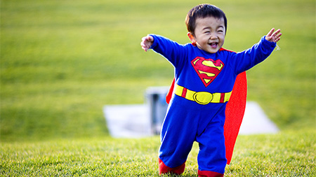 Haruto Yoshikawa chases his big brother while donning his Superman halloween costume on the West Lawn Wednesday evening. Yoshikawa is a refreshing reminder of why houseowners give out candy to young kids and not college students.