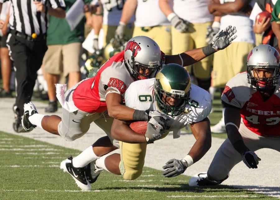 Runningback Chris Nwoke (6) is brought down after a 38 yard rush that gave the Rams a first down in the second quarter against UNLV in Las Vegas, NV last year. This weekend the Rams will face UNLV again at Hughes Stadium at 5p.m.