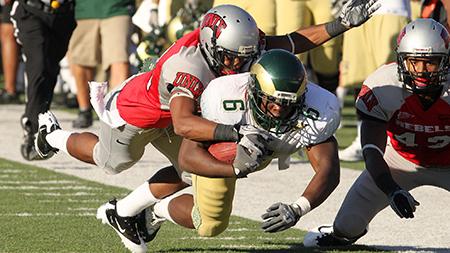 Runningback Chris Nwoke (6) is brought down after a 38 yard rush that gave the Rams a first down in the second quarter against UNLV in Las Vegas, NV last year. This weekend the Rams will face UNLV again at Hughes Stadium at 5p.m.