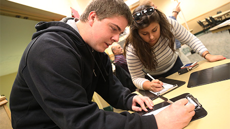 Student voter Hunter Sohl prepares to register to vote early in the Lory Student Center. President Obama seems to be paying a lot of attention to student voters in hopes they will swing him into office for a second term.