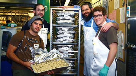 From left: Trevor Heyman, Myles Sedgwick, Rabbi Yerachmiel Gorelik, and Michael Lichtbach prepare food for the Shabbat Dinner on Wednesday afternoon. The dinner will be held Friday night at 7 pm. in the Lory Student Center Main Ballroom.