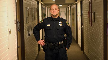Officer Paul Ashe works the swing shift Monday in Parmelee Hall. Colorado State University Police Department has increased their presence in the Residents Halls recently.