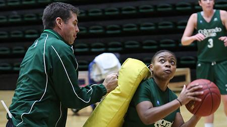 Guard LeDeyah Forte (1) fights through pressure from head coach Ryun Williams during practice Monday afternoon. The Rams are looking for their first win of the season tonight at Moby arena against UNC.