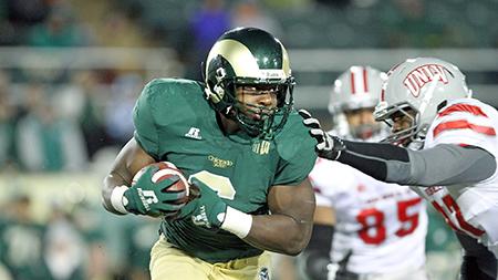 Runningback Chris Nwoke (6) breaks through the UNLV defense during the Ram victory Saturday night at Hughes Stadium. The Rams won 33-11.