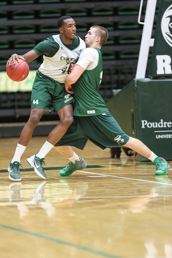 Greg Smith, 44, attempts to push past Pierce Hornung, 4, during practice. The Rams will be looking for their second straight home win against Chadron State tomorrow night at Moby Arena.