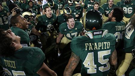 Senior Zach Tiedgen, 47, leads the team in a victory chant after Saturdays win over New Mexico at Hughes stadium. After fighting back and forth the entire game, the Rams previled 24-20 over the Lobos to end the season 4-8.