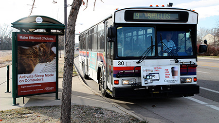 Tuesday morning, a bus driver waits for the massive group students who just boarded to take their seats. In the morning and afternoon bus stops like this one lare packed with CSU students traveling to and from campus.