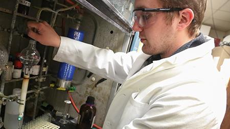 Graduate student Todd Hyster works in the chemistry lab Tuesday afternoon. Hyster created an artificial metalloenzyme that is gaining recocgnition throughout the science community.