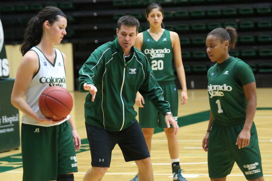 Head Coach Ryun Williams explains a new play to Emily Johnson,10, and LaDeyah Forte,1, during practice. The Rams face Loyola Marymont in Los Angeles this evening and are in search of thier first road win of the year.