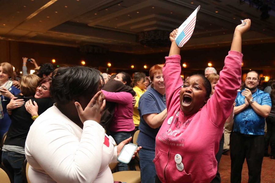 Asia Taylor, right, and her sister Ashlee celebrate the election of Barack Obama as President of the United States at the Colorado Democratic watch party in the Sheridan Hotel in Downtown Denver, Colo. Tuesday night.
