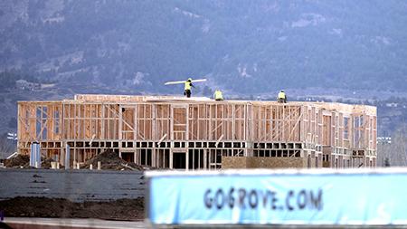 Workers are seen ontop of the Grove apartments construction site overlooking horsetooth rock Monday afternoon. Construction of the recent Grove apartments has brought questions up on the location and funding of the apartments.