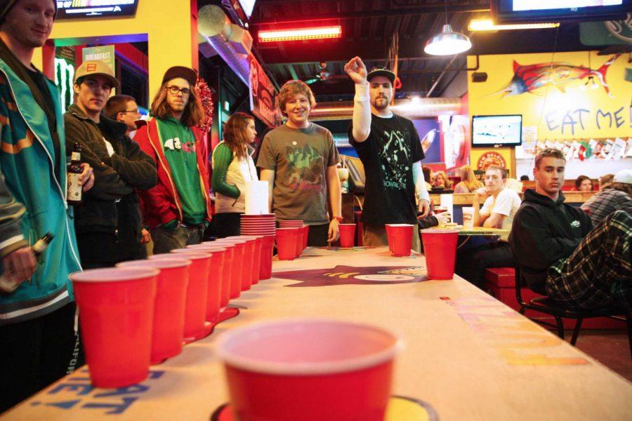 To pass the time before a ski movie premier, CSU Senior Spencer Kaye and Sophomore Ben Wolf play pong at Fuzzy's Taco Shop Saturday evening. Spencer Kaye is the current president of Snow Riders (CSU Ski/Snowboard club) and helped organize the movie premier as well as a benefit raffle for foster children wishing to spend a day on Colorado's snowy slopes.