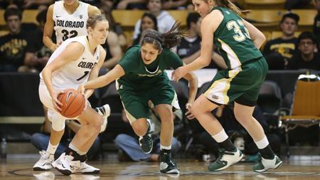 Colorado State forward Kara Spotton (20) attempts to steal the ball from Colorado's Lexy Kresl during the first half of last nights game in Boulder. The Lady Rams fell short to the Buffs 72-46.