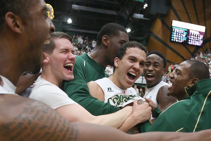 Colorado State Rams players mug Dorian Green after their second straight home conference win. After his performace in Saturday nights game, Green was awarded the Mountain West player of the week.