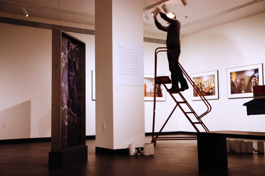 Keith Jentzsch, UCA Programs and Exhibition Coordinator, sets up lights for the upcoming UCA art exhbition, "Modern Metal: Functional Design for Life”. "Modern Metal: Functional Design for Life” features metal crafted into extraordinary functional objects for modern life. It opens Janurary 26th and will close on May 18th.