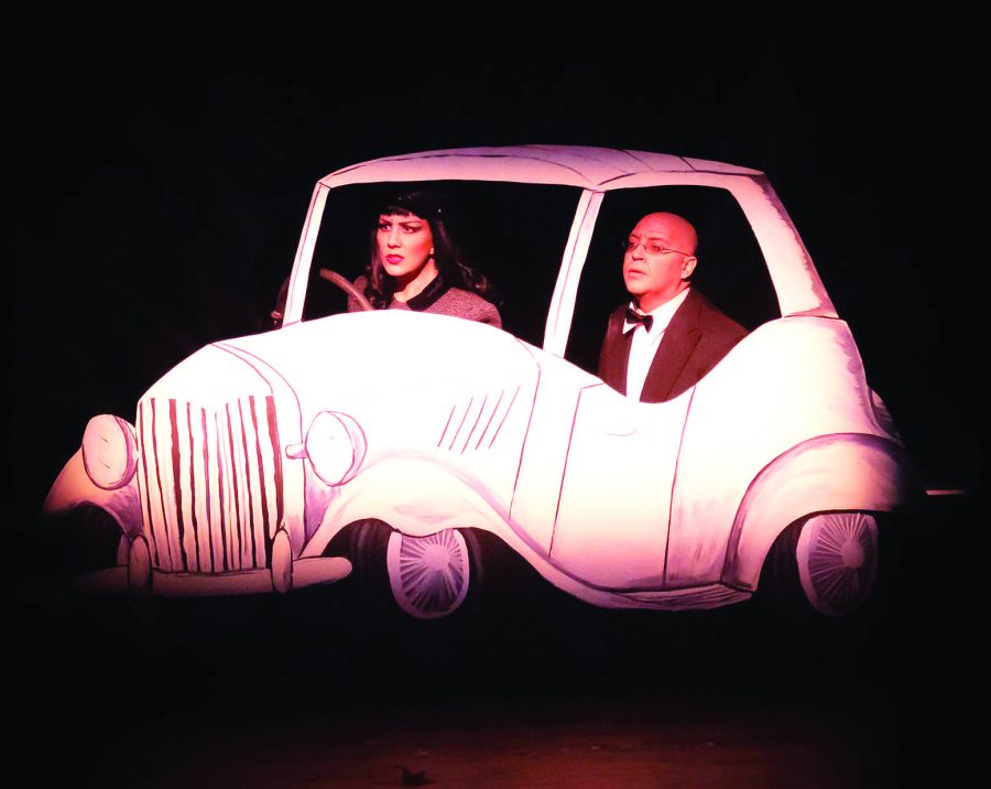 Ailie Holland as Lenya Von Brunno, left, and Justin Batson as Otto Von Brunno perform the car chase scene from Bullshot Crummond in the Lincoln Center. The play is a spoof off of a grade-B detective movies including a damsel in distress and car chases.