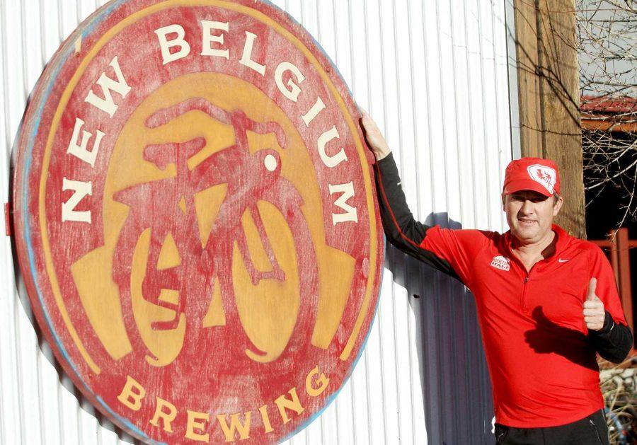 Steve Cathcart, event director of the Horsetooth Marathon, stands in front of the New Belgium Brewery, the finish line for the marathon. Cathcart has been the director of the race for eight years.