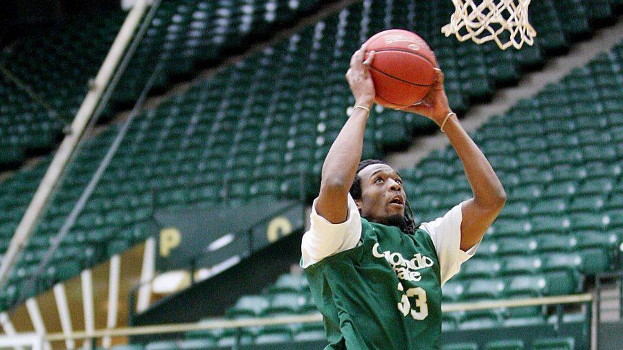 Dwight Smith (33) goes up for a dunk against Assistant Head Coach Leonard Perry at practice. The Rams will be playing against Boise State in Moby Arena at 7 PM tonight.