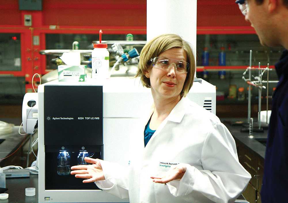 Professor Melissa Reynolds discusses findings with her graduate research assistants in lab last Thursday. Reynolds's research focuses on molecular design and fabrication of biomimetic materials that can be used in medical device applications.