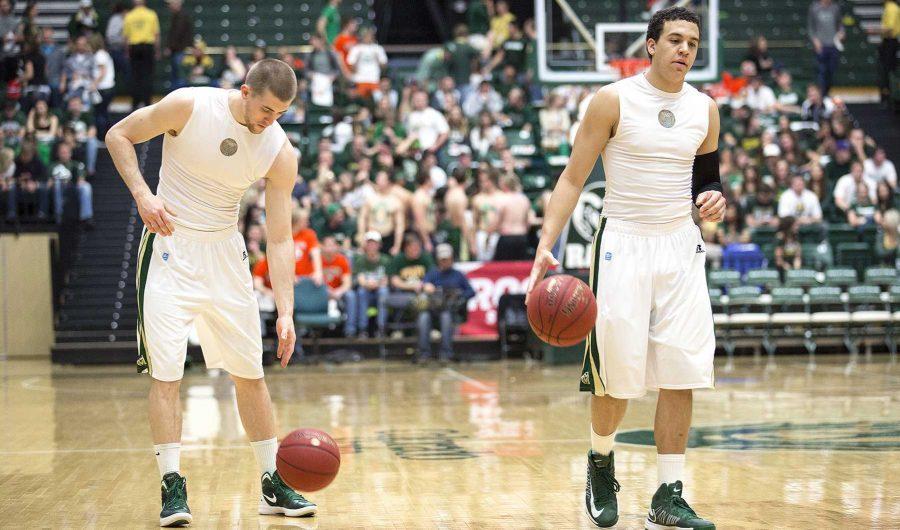 Pierce Hornung, left, and Dorian Green warm up as Moby fills to a sellout crowd against Wyoming Saturday afternoon. Tip-off is at 5 p.m.