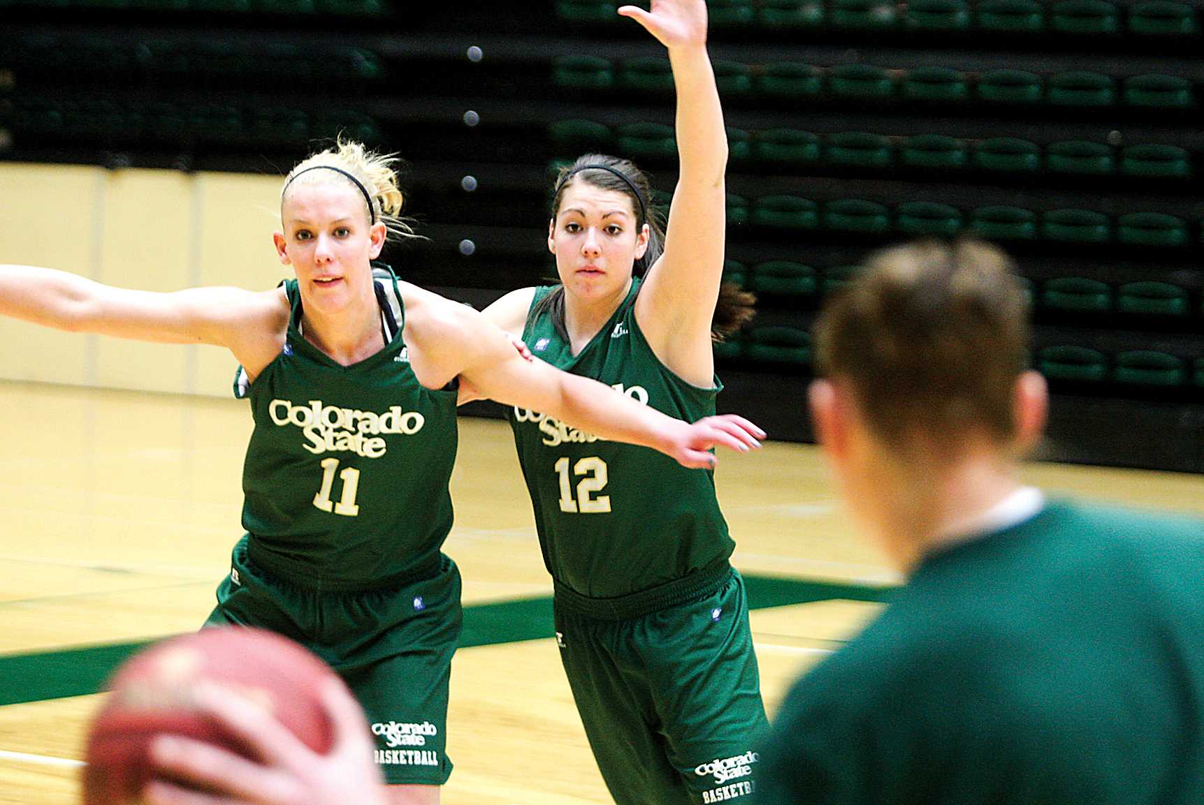 Sam Martin (12) defends Meghan Heimstra (11) at practice on Monday in Moby Arena. The Rams prepare to take on Nevada in Moby Arena at 7 Wednesday night.