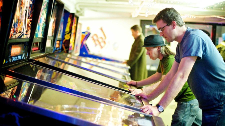 Eric Tamme plays the pinball machine named Twilight Zone at Pinball Jones Wednesday night. The pinball club meets twice a month and competes at different venues around Fort Collins.