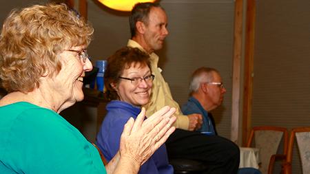 Elaine Branjord (left) and Maria Logsdon (right) enthusiastically watch President Obama hold the State of the Union address on Tuesday night. Mr. and Mrs. Branjord hosted a democratic watch party at their residence in Fort Collins.