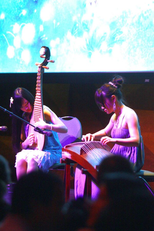 Liang Haiyin and Yin Meina play traditional Chinese string instruments at the Chinese New Years celebration in the LSC Theatre Saturday night. This Chinese new year marks the year of the snake.