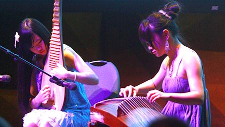 Liang Haiyin and Yin Meina play traditional Chinese string instruments at the Chinese New Years celebration in the LSC Theatre Saturday night. This Chinese new year marks the year of the snake.