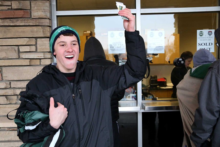 Freshman health and excersises major Jamey Cohen celebrates after waiting through the cold to get tickets for Saturday's game outside of Moby Arena Wednesday morning. Students began lining up as early as Tuesday night to be one of the first to grab their free ticket to Saturday's home matchup against New Mexico.