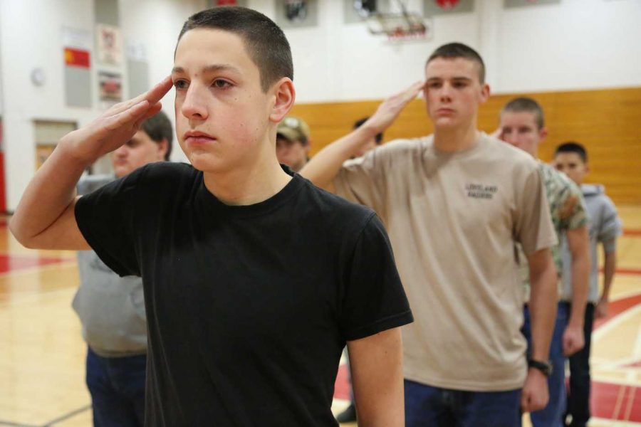 Member of the Loveland High School JROTC drill team Alex Bartnes presents arms during practice Wednesday morning. The group will be competing in the Ram Battalion Drill Meet tomorrow.