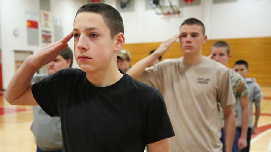 Member of the Loveland High School JROTC drill team Alex Bartnes presents arms during practice Wednesday morning. The group will be competing in the Ram Battalion Drill Meet tomorrow.