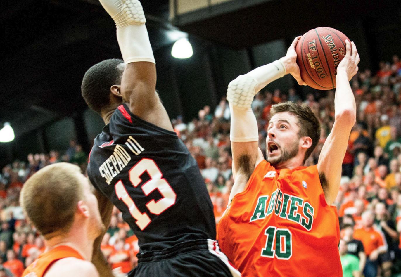 Wes Eikmeier, 10, attempts to shoot over a San Diego defender last wednesday in Moby's first ranked matchup game. With possibilities of clinching first in the Mountain West Conference title, excitement for CSU basketball has been at an all time high.