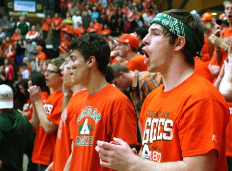 Freshman Blake Jarvis, right, cheers on the Rams during the Orange Out game against San Diego State in Moby Arena.