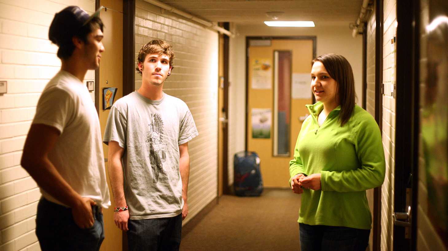 Kate Amsden, right, a second year RA in Parmele Hall, checks in with her residents Monday night. A Resident Assistant helps develop community for students living in the halls.